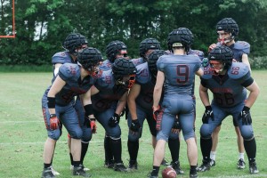 The Dragons' defensive huddle (Photo courtesy of Harmony Ayala-Ruiz)