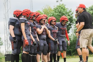 Head coach Dan Ruiz speaking to his offense (Photo courtesy of Harmony Ayala-Ruiz).